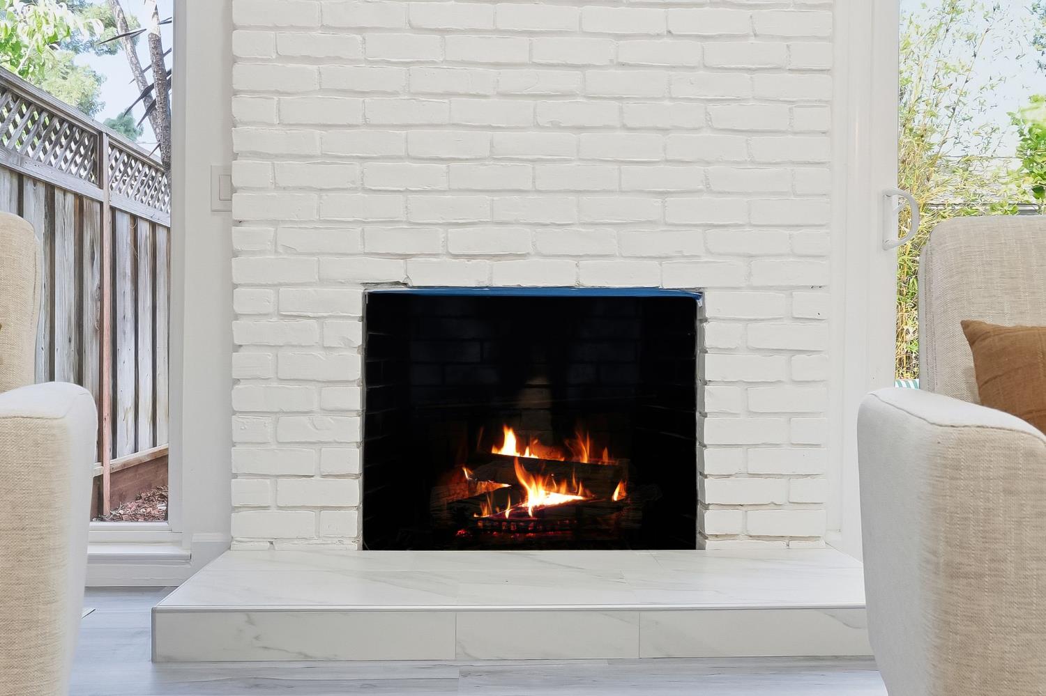672 North San Antonio Road Los Altos, CA 94022 - Photo 5 of 22 a fireplace with a lamp