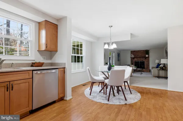 a kitchen with appliances a refrigerator and cabinets