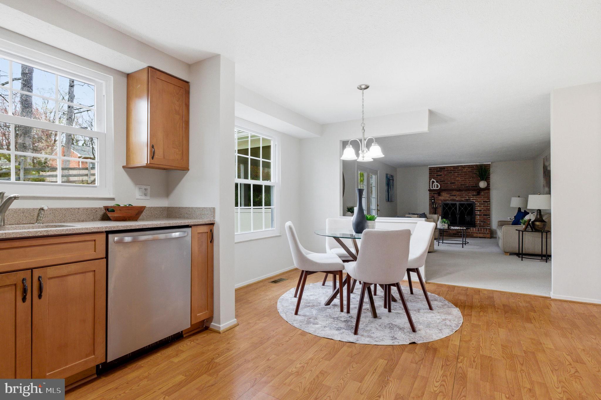 5755 Heming Avenue Springfield, VA 22151 - Photo 20 of 71 a dining room with furniture a chandelier and wooden floor