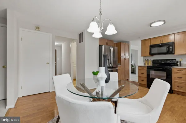 a living room with furniture a rug and a table