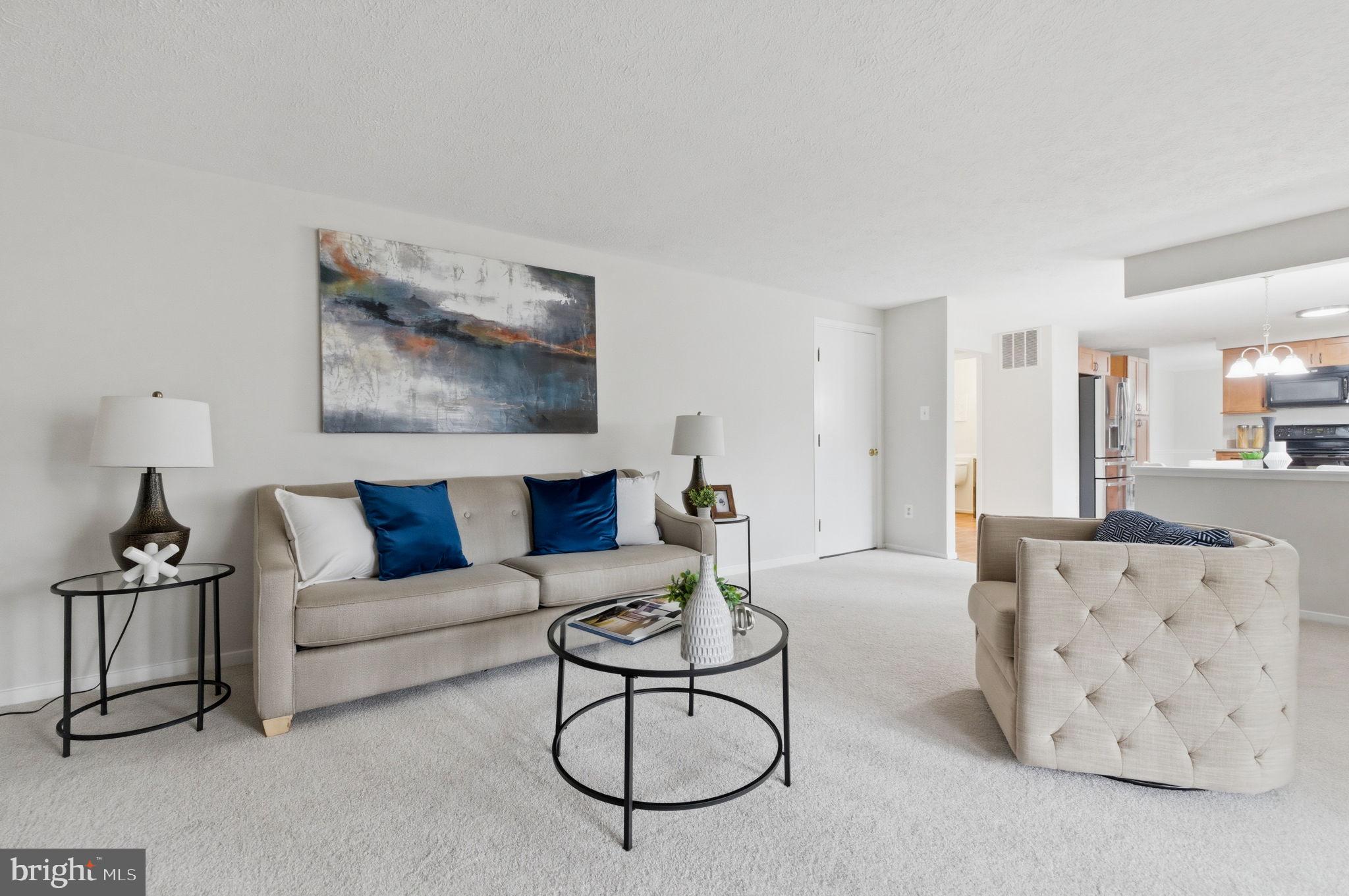 5755 Heming Avenue Springfield, VA 22151 - Photo 24 of 71 a living room with furniture a rug and a table