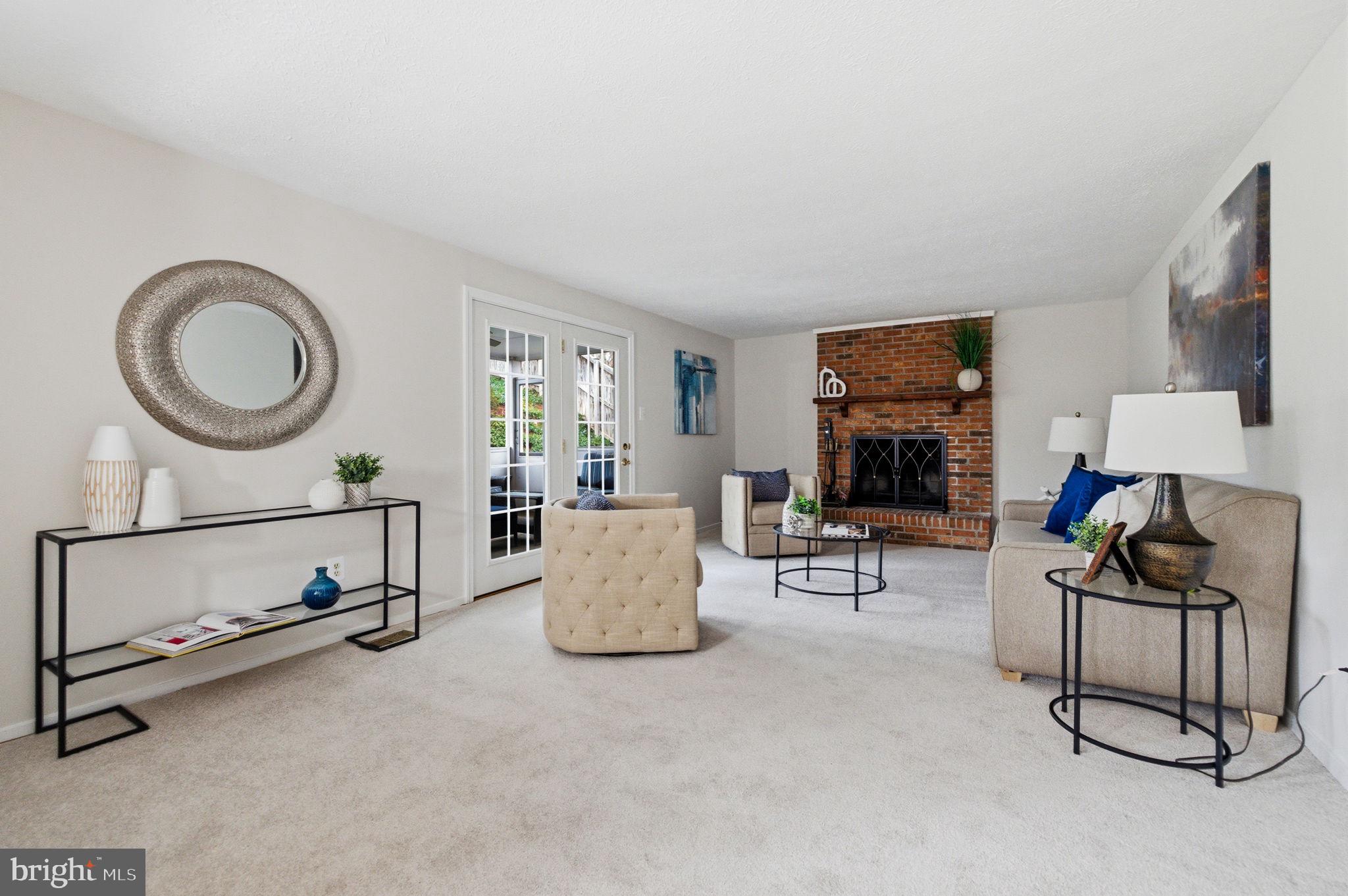 5755 Heming Avenue Springfield, VA 22151 - Photo 25 of 71 a living room with furniture a flat screen tv and a window