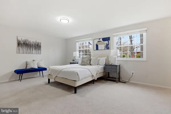 a bedroom with a bed and a table