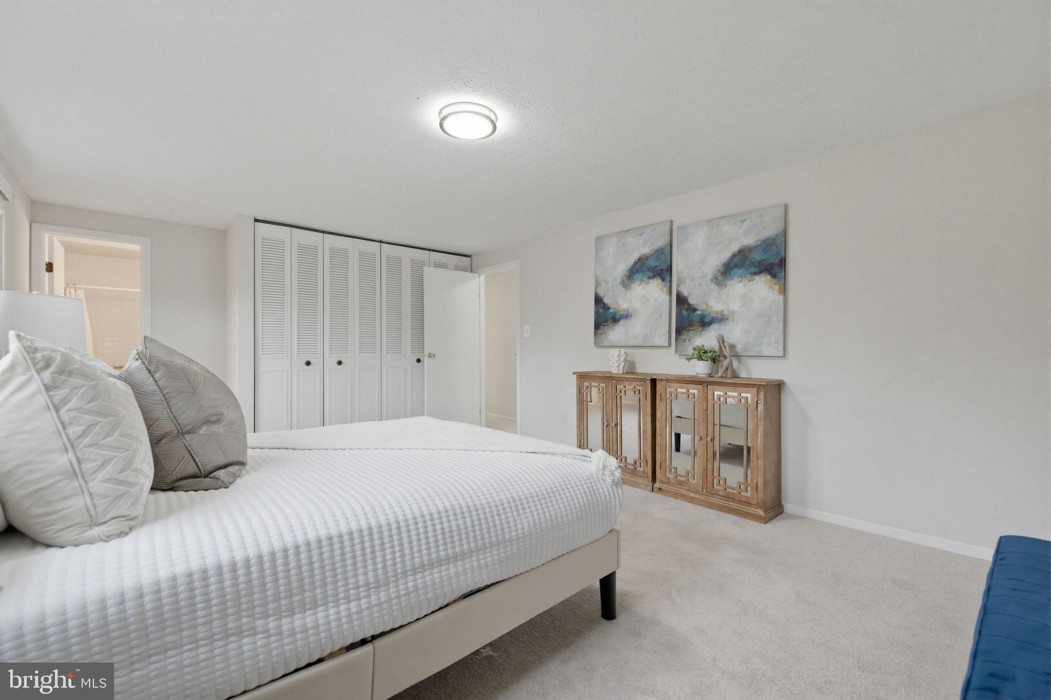 5755 Heming Avenue Springfield, VA 22151 - Photo 38 of 71 a bedroom with a bed and a table