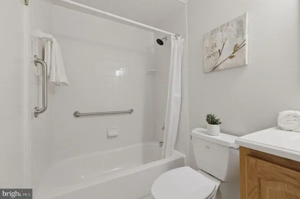 a view of a bathroom with a glass door and a window