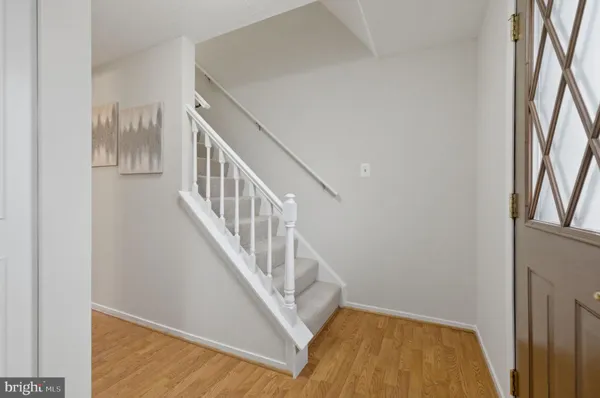 a view of entryway with wooden floor
