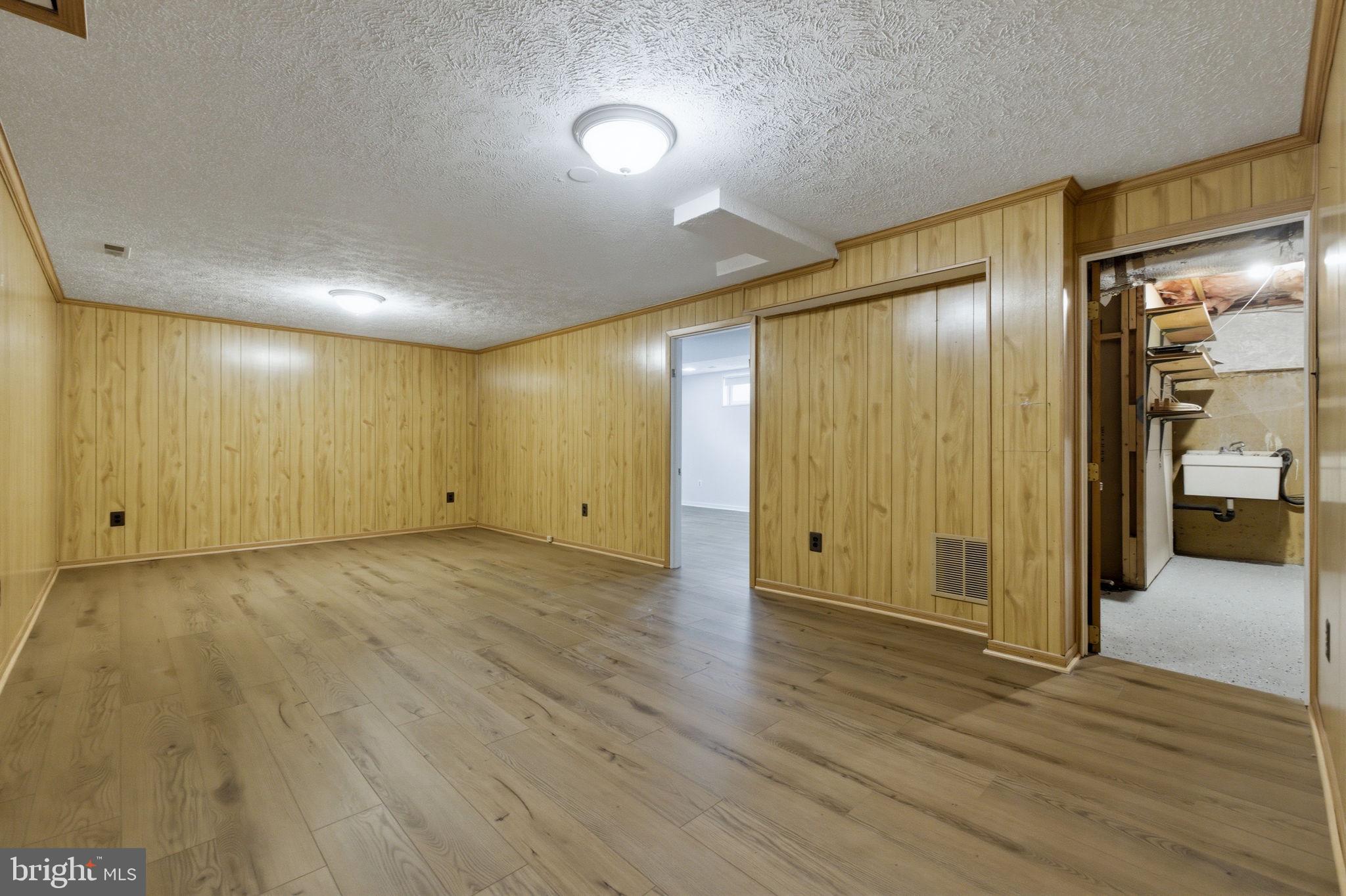 5755 Heming Avenue Springfield, VA 22151 - Photo 54 of 71 a view of empty room with wooden floor
