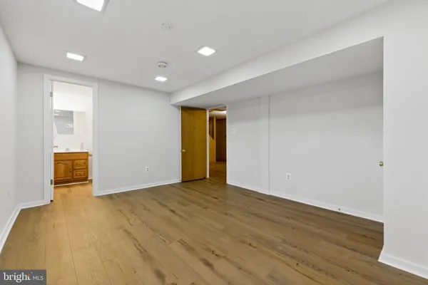 a bathroom with a shower and a sink