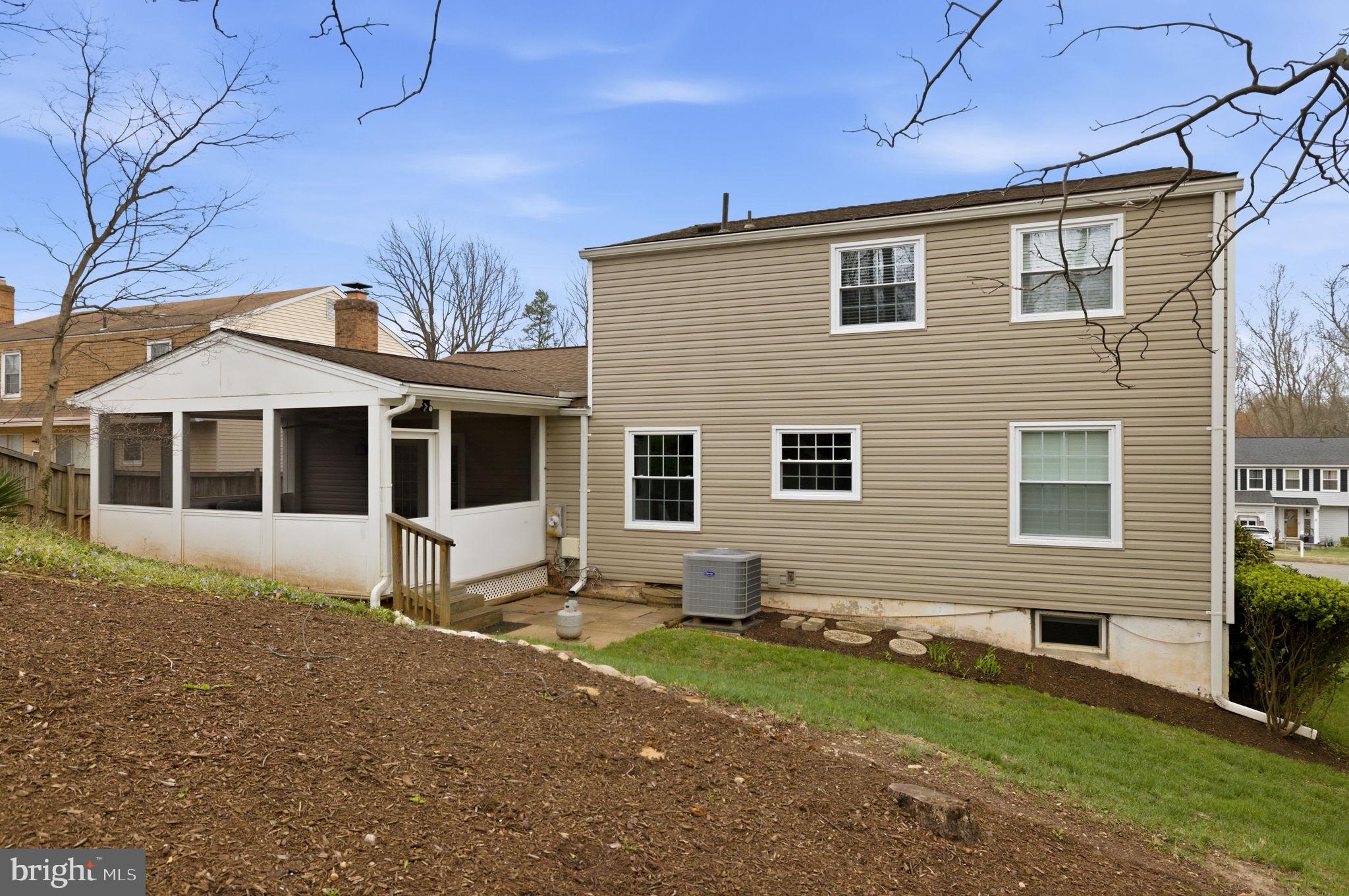 5755 Heming Avenue Springfield, VA 22151 - Photo 65 of 71 a front view of a house with a yard