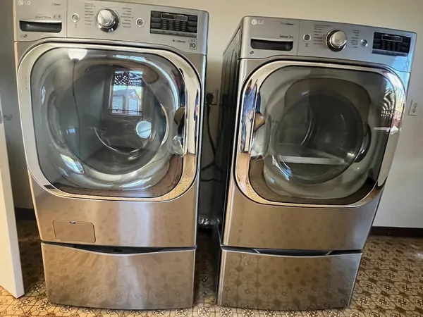 a utility room with dryer and washer