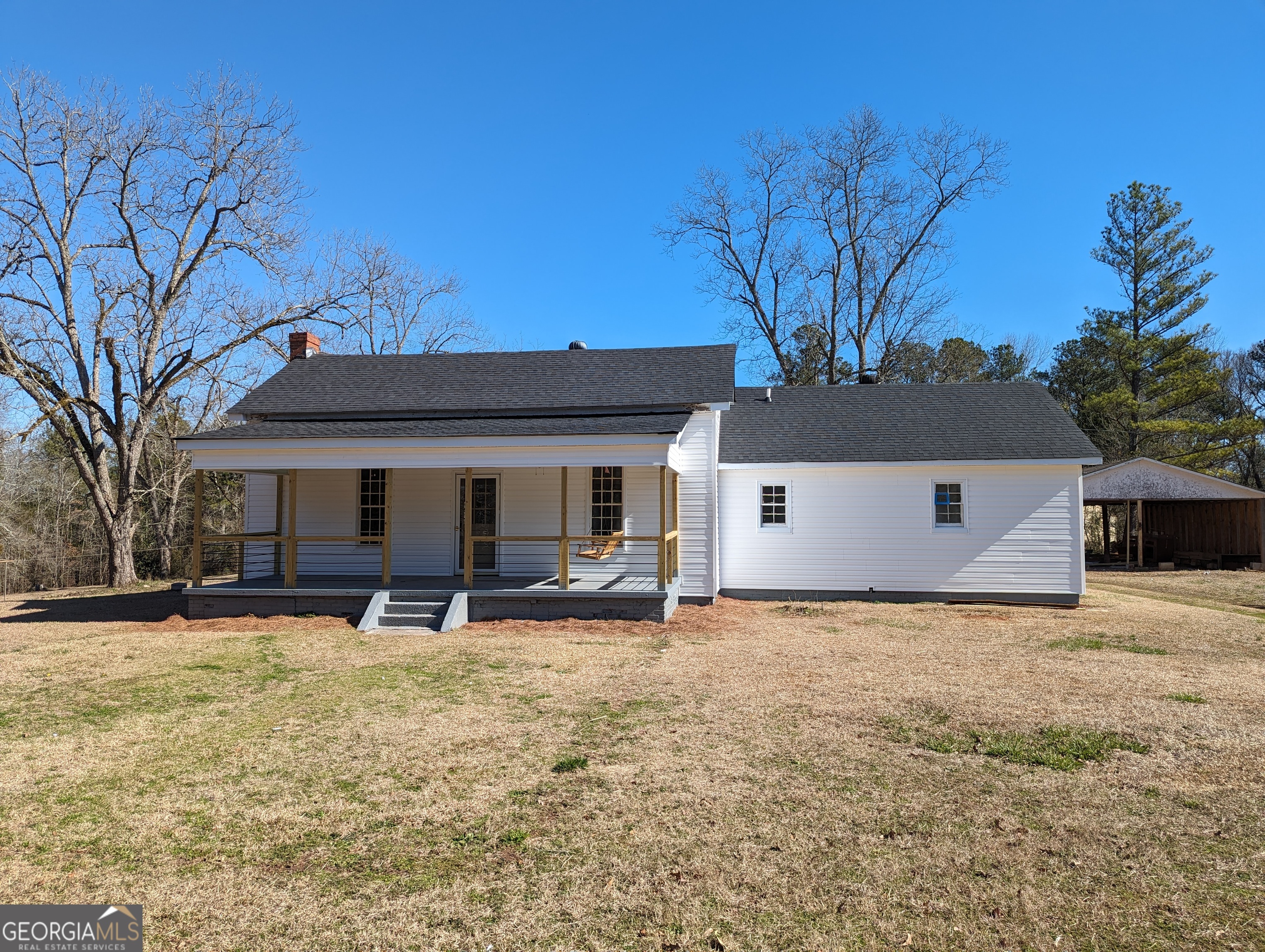 134 Delray Road Thomaston, GA 30286 - Photo 1 of 1 a front view of house with yard and trees