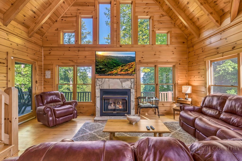 2229 Elk Ridge Road Ferguson, NC 28624 - Photo 10 of 42 a living room with furniture fireplace and a large window