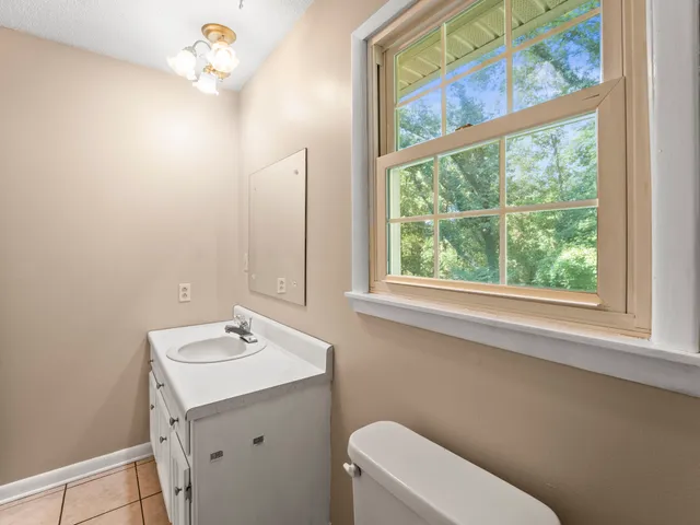 a bathroom with a shower a toilet and a shower