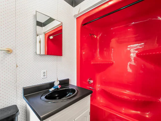 a view of an empty room with a window