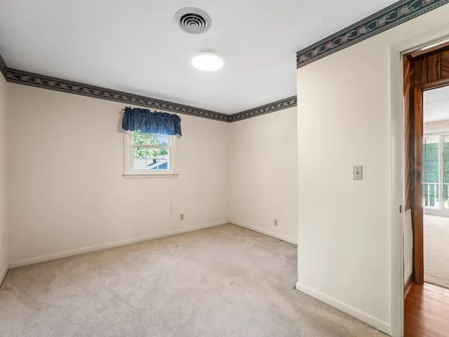 a view of a room with next to a ceiling window