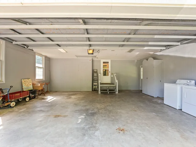 a view of a house with a tree in a yard