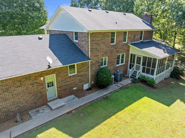 a aerial view of a house with a yard