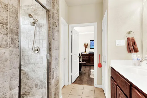a bedroom with bed and wooden floor