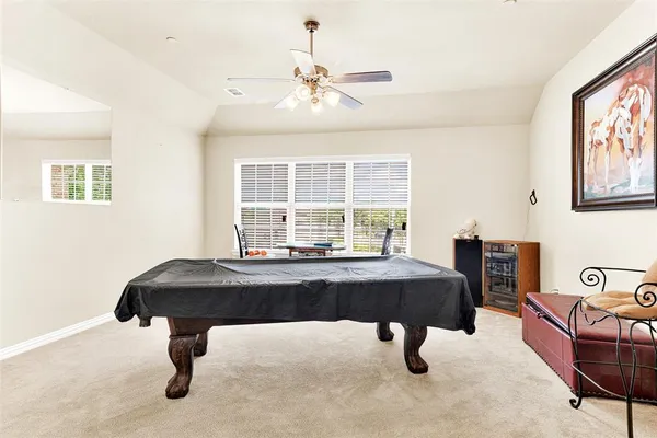 a hallway with sink and mirror
