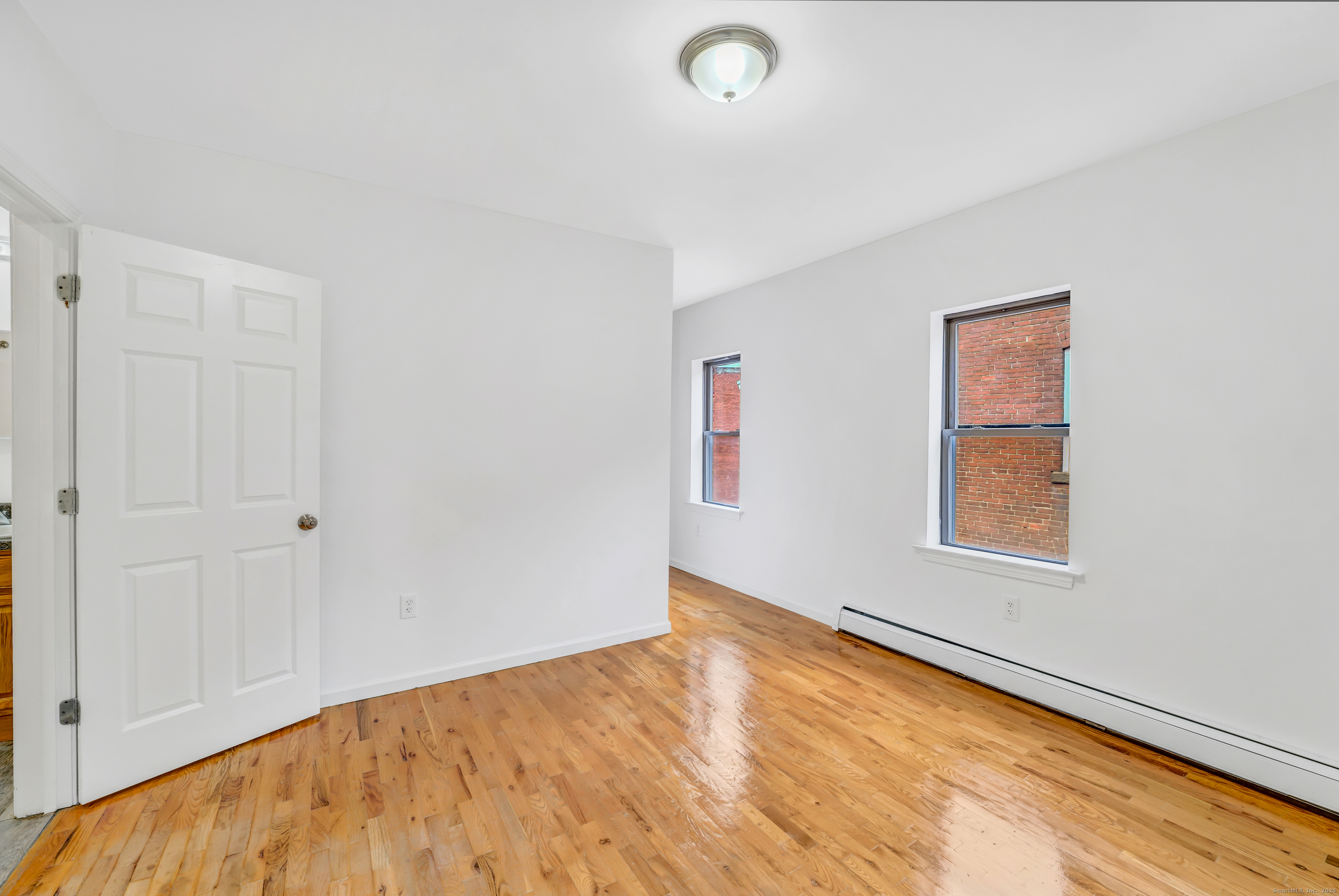 1004 Broad Street, Unit 4S Hartford, CT 06106 - Photo 3 of 8 a view of an empty room and window