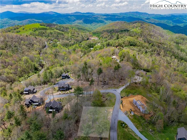 a view of a city with mountains in the background