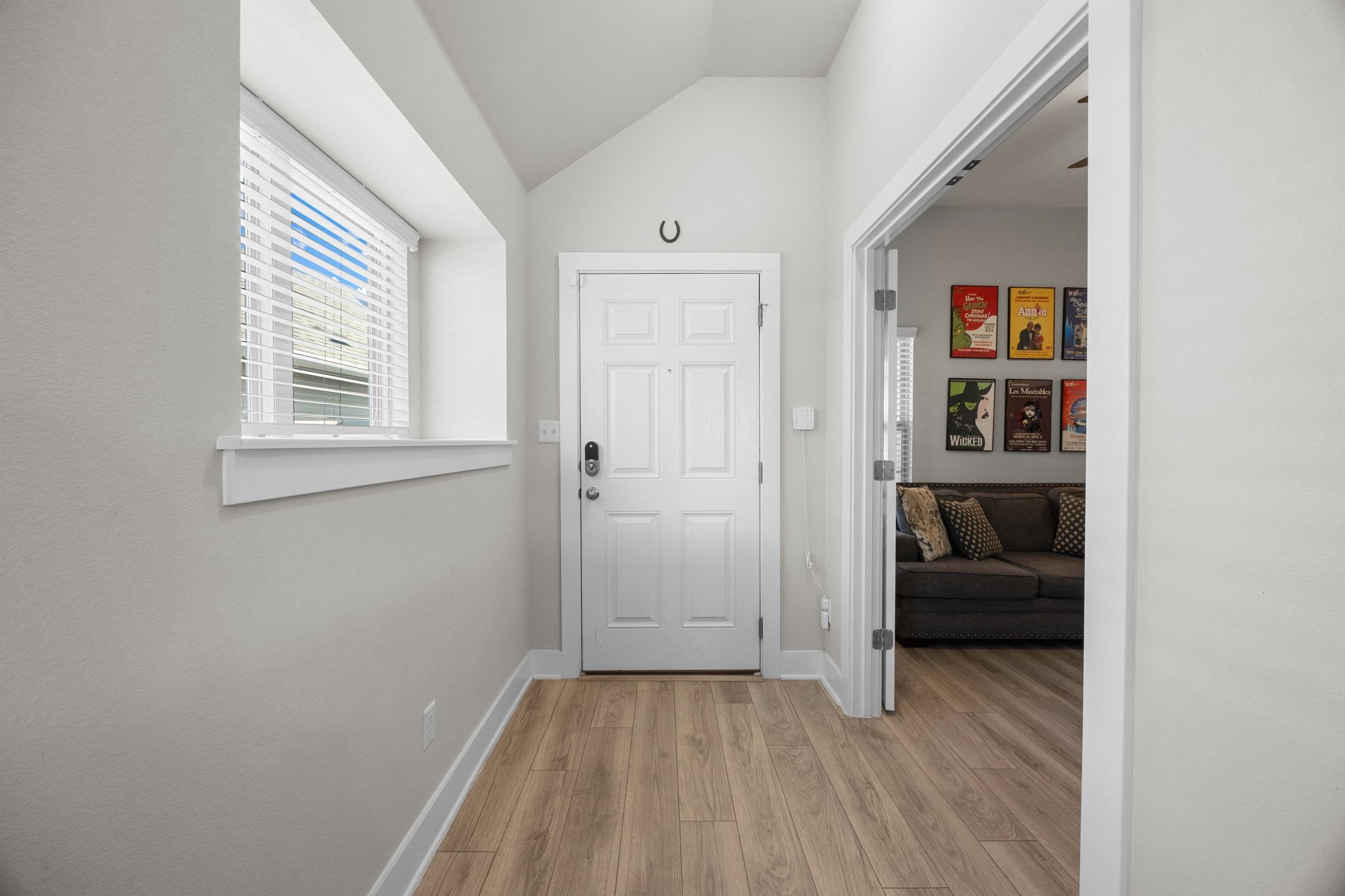 4807 Portillo Way Pflugerville, TX 78660 - Photo 4 of 24 Entrance foyer with vaulted ceiling and light wood finished floors
