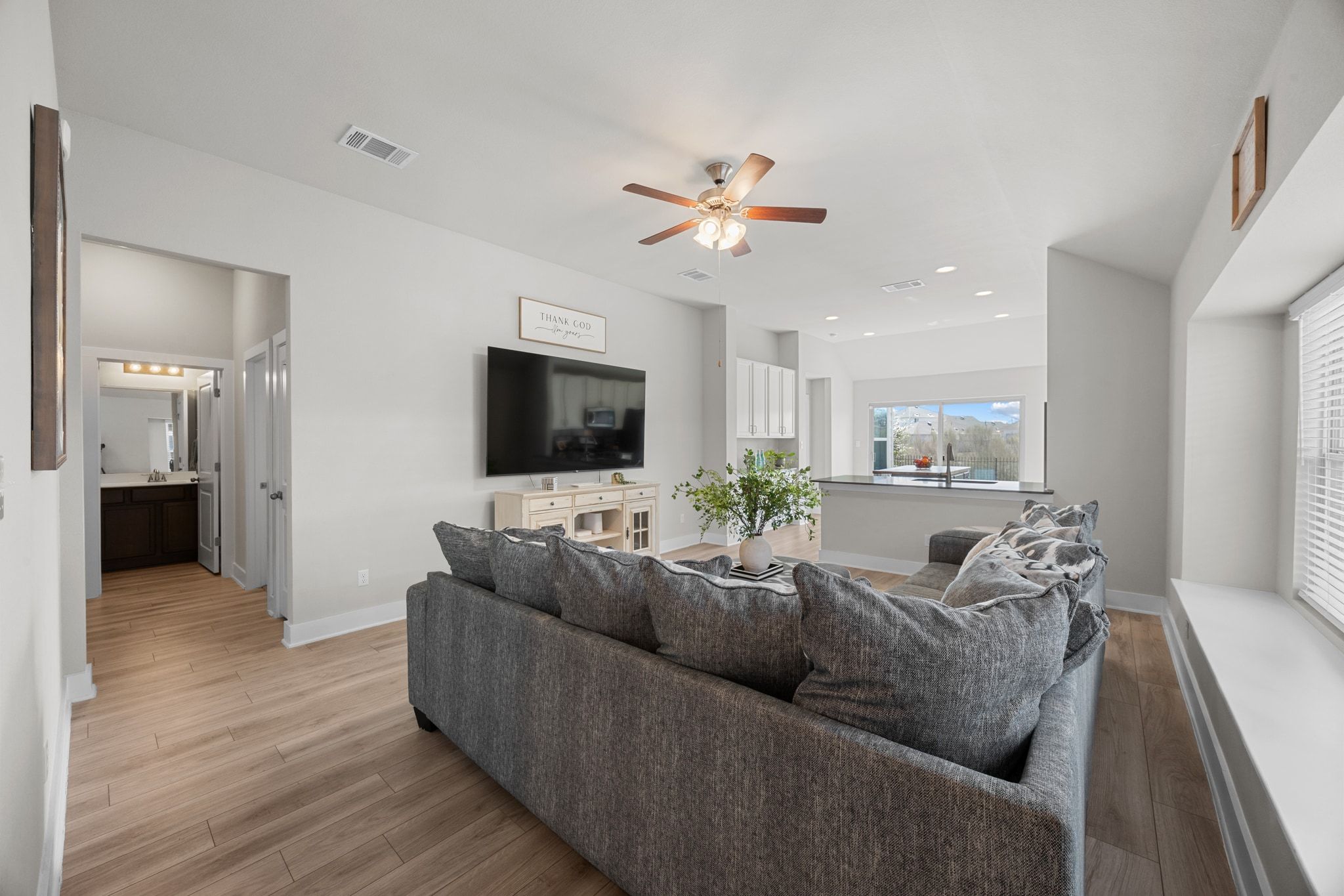 4807 Portillo Way Pflugerville, TX 78660 - Photo 5 of 24 Living room with light wood finished floors, ceiling fan, and recessed lighting