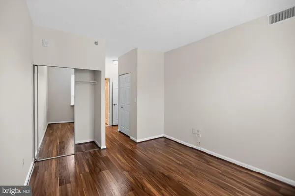 a view of wooden floor in an empty room