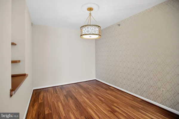 a view of a room with wooden floor and utility