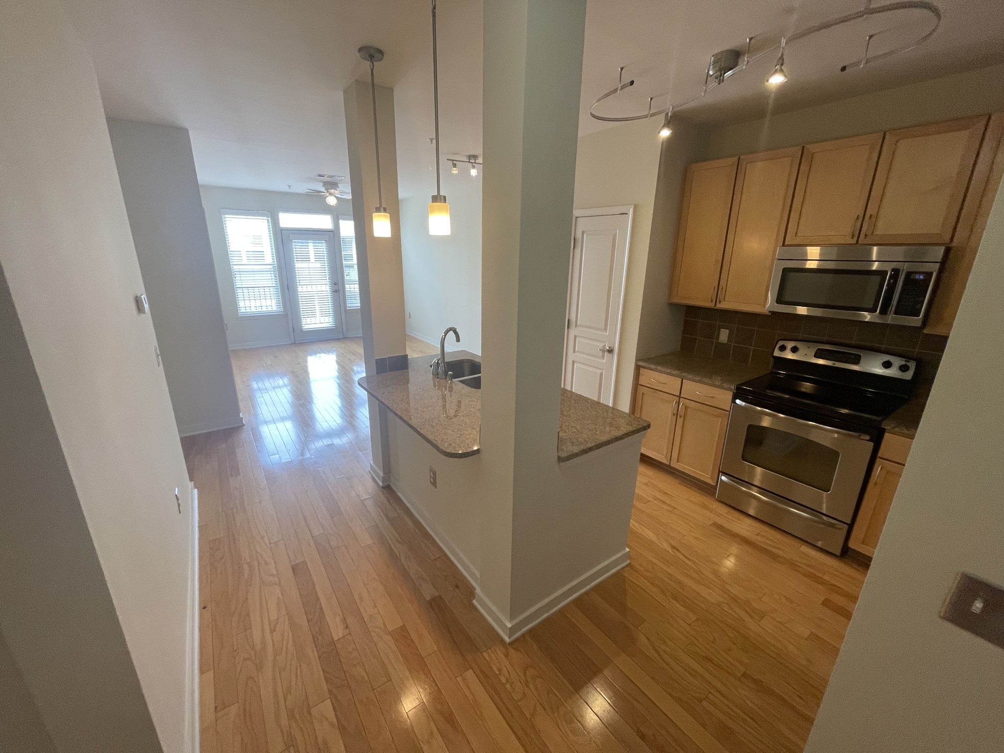 3000 Vanderbilt Place, Unit 412 Nashville, TN 37212 - Photo 2 of 13 a view of a kitchen from the hallway