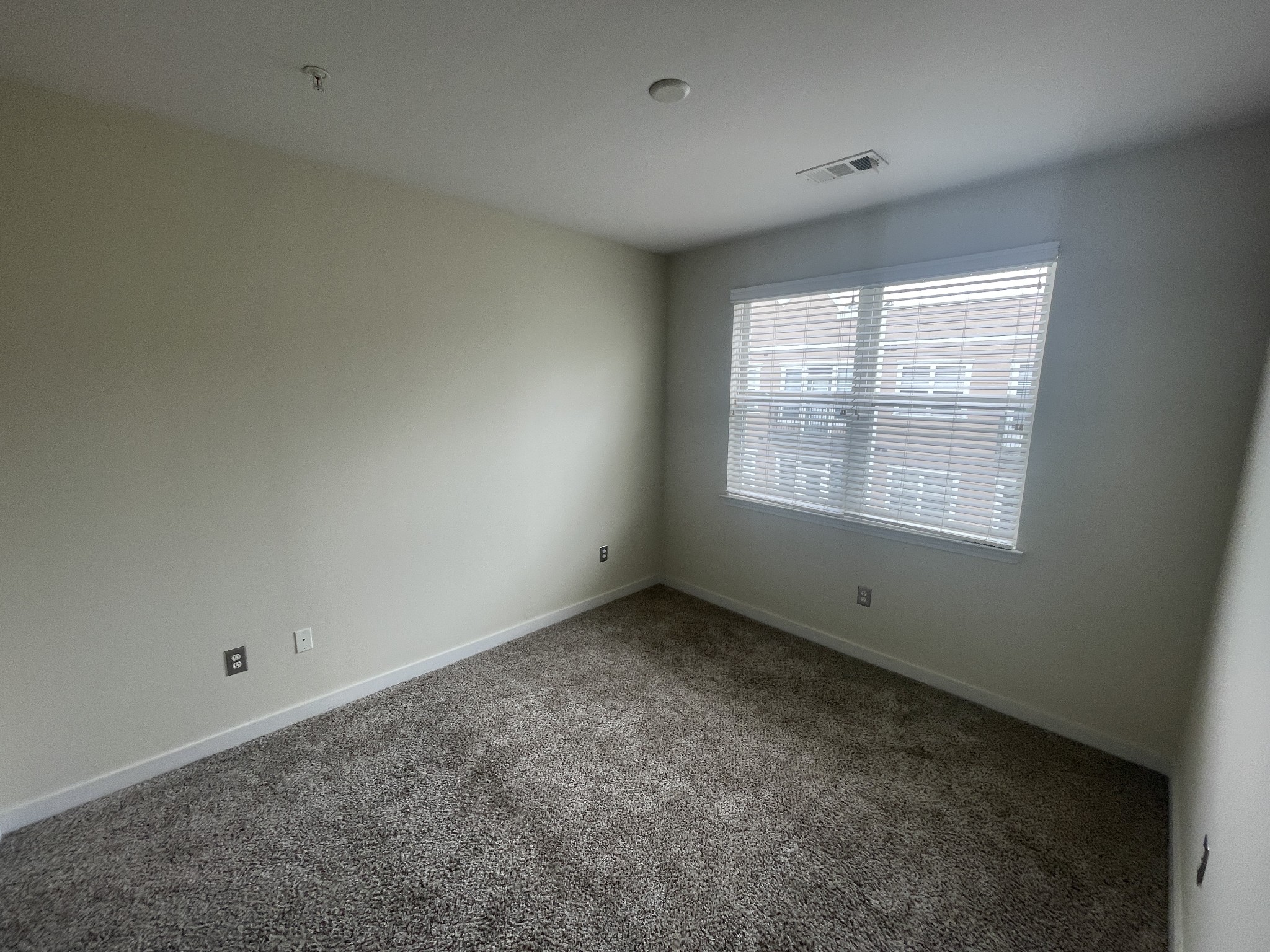 3000 Vanderbilt Place, Unit 412 Nashville, TN 37212 - Photo 7 of 13 an empty room with a window