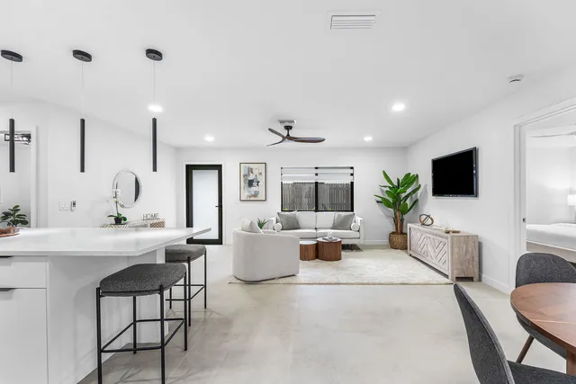 a kitchen with stainless steel appliances a stove microwave and refrigerator