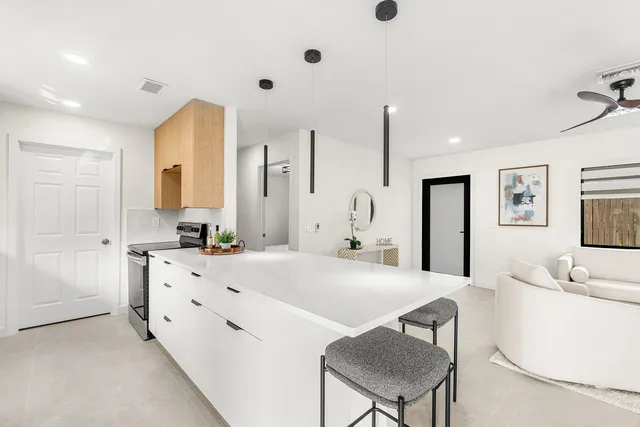 a kitchen with a sink and a refrigerator