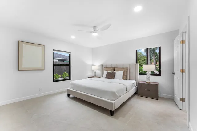 a bedroom with a bed and a table