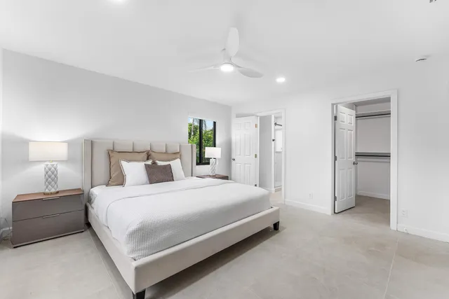 a bedroom with a bed and a table