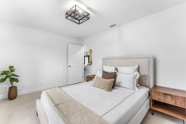 a backyard of a house with palm trees