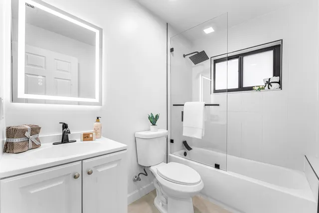 a view of a park with potted plants