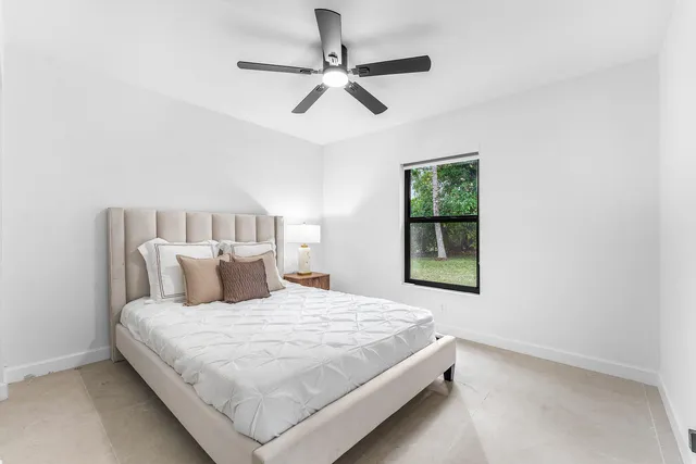 a backyard of a house with plants and trees