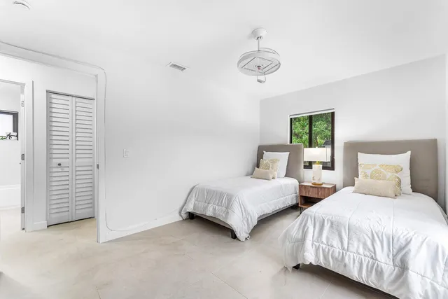 a view of a backyard with large trees