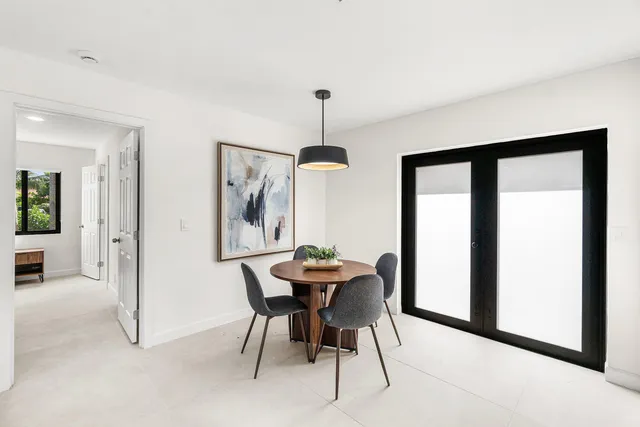 a kitchen with a refrigerator and a sink