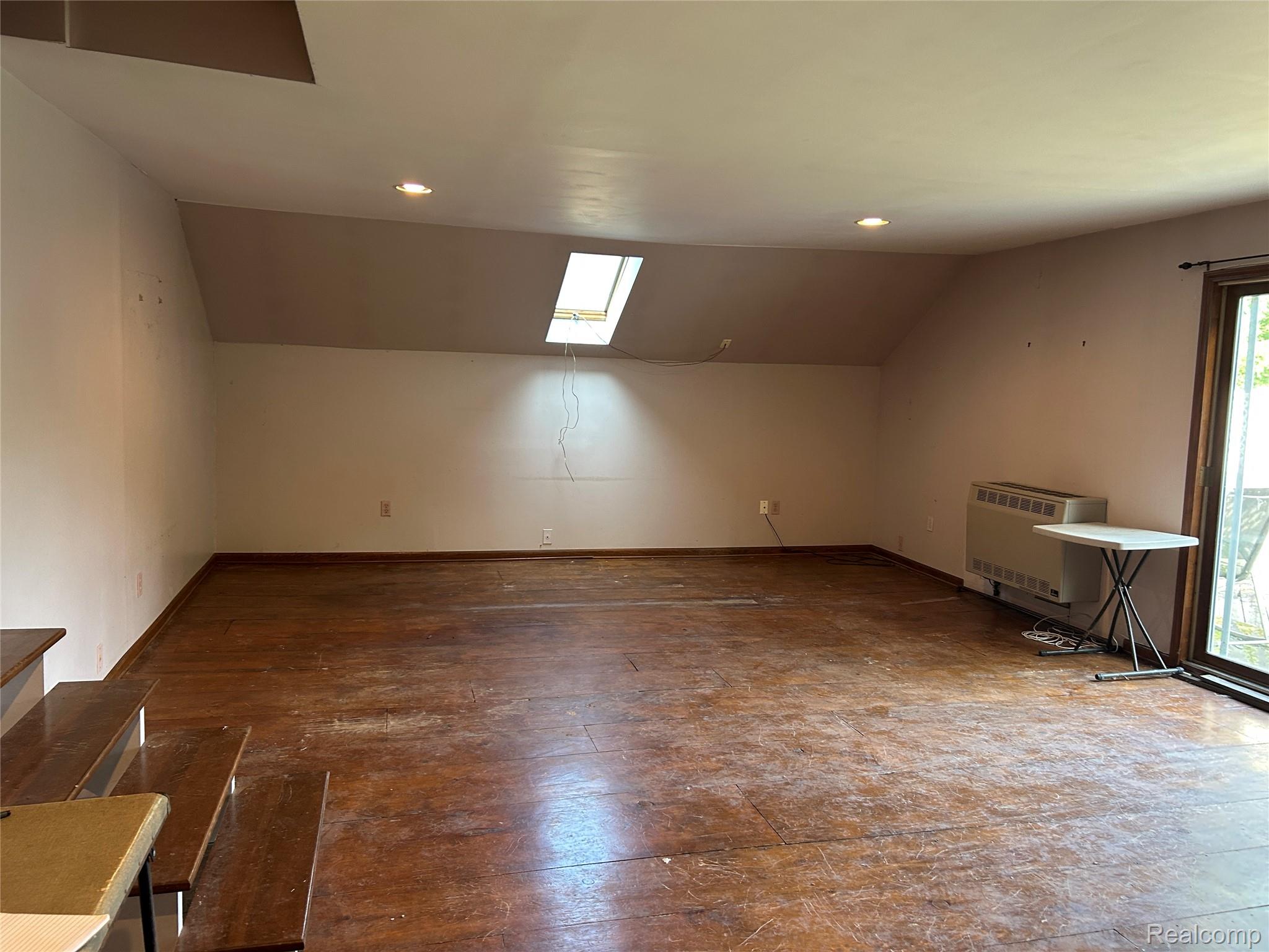 1285 Grange Hall Road Fenton, MI 48430 - Photo 20 of 50 Spacious Bonus Room with wood-finish flooring, an angled ceiling, and a skylight