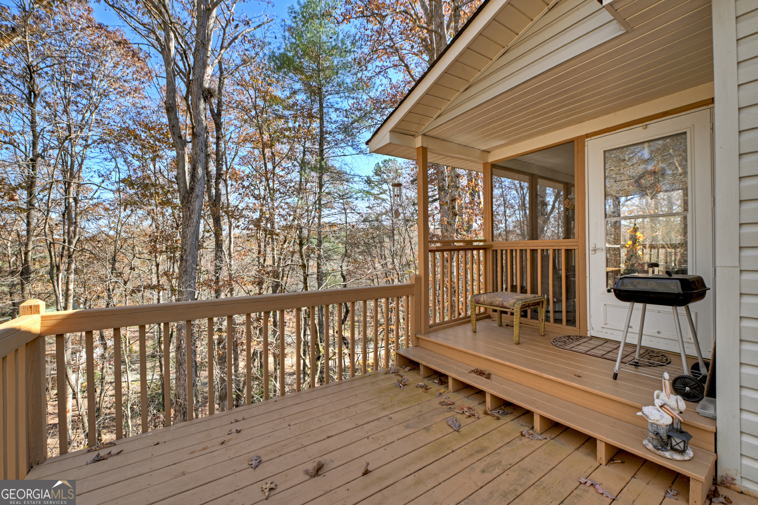 122 D D J Lane Ellijay, GA 30540 - Photo 15 of 51 a balcony with wooden floor table and chairs
