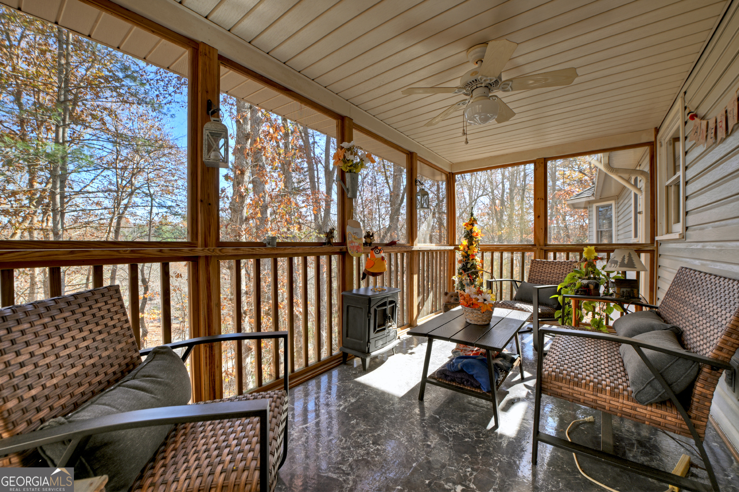 122 D D J Lane Ellijay, GA 30540 - Photo 16 of 51 a living room with furniture floor to ceiling window and a table