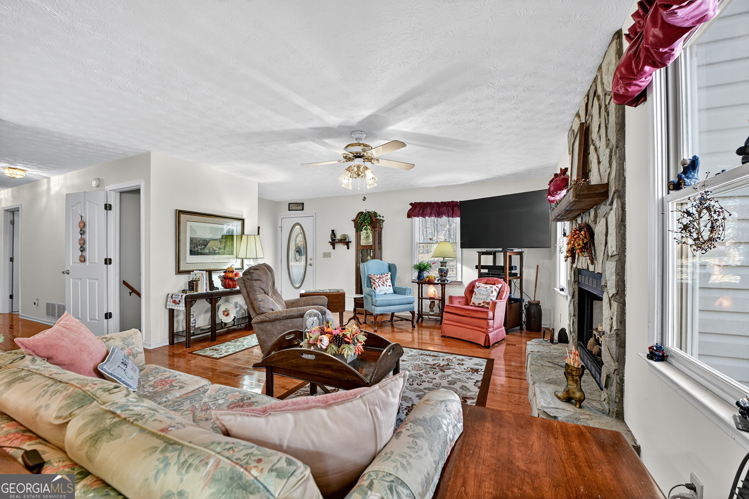 122 D D J Lane Ellijay, GA 30540 - Photo 19 of 51 a living room with furniture and a flat screen tv