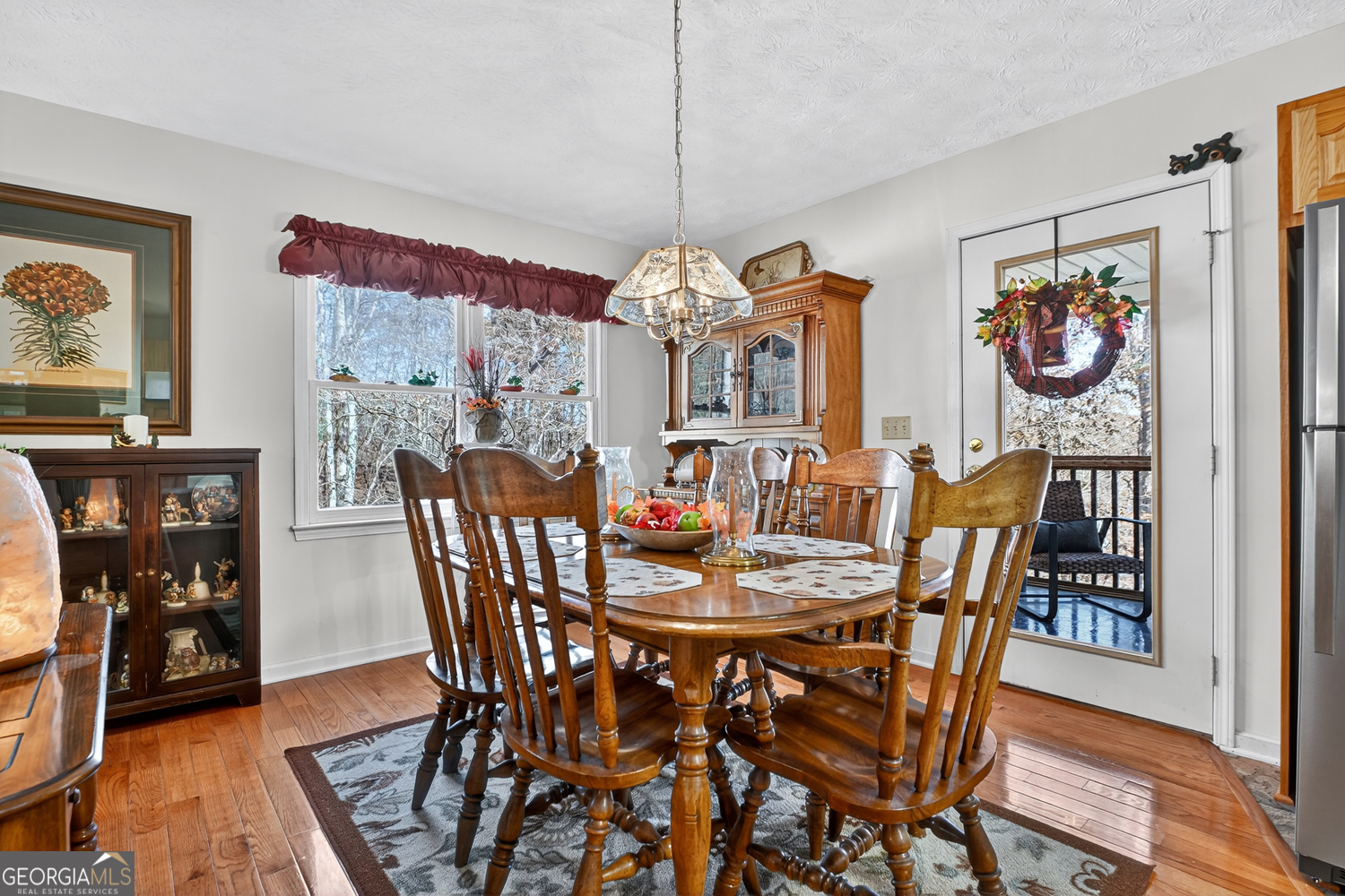122 D D J Lane Ellijay, GA 30540 - Photo 21 of 51 a view of a dining room with furniture kitchen and wooden floor