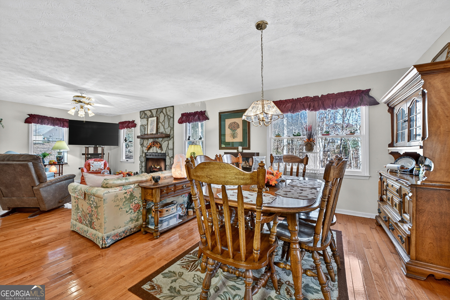 122 D D J Lane Ellijay, GA 30540 - Photo 22 of 51 a view of a dining room with furniture a kitchen and chandelier