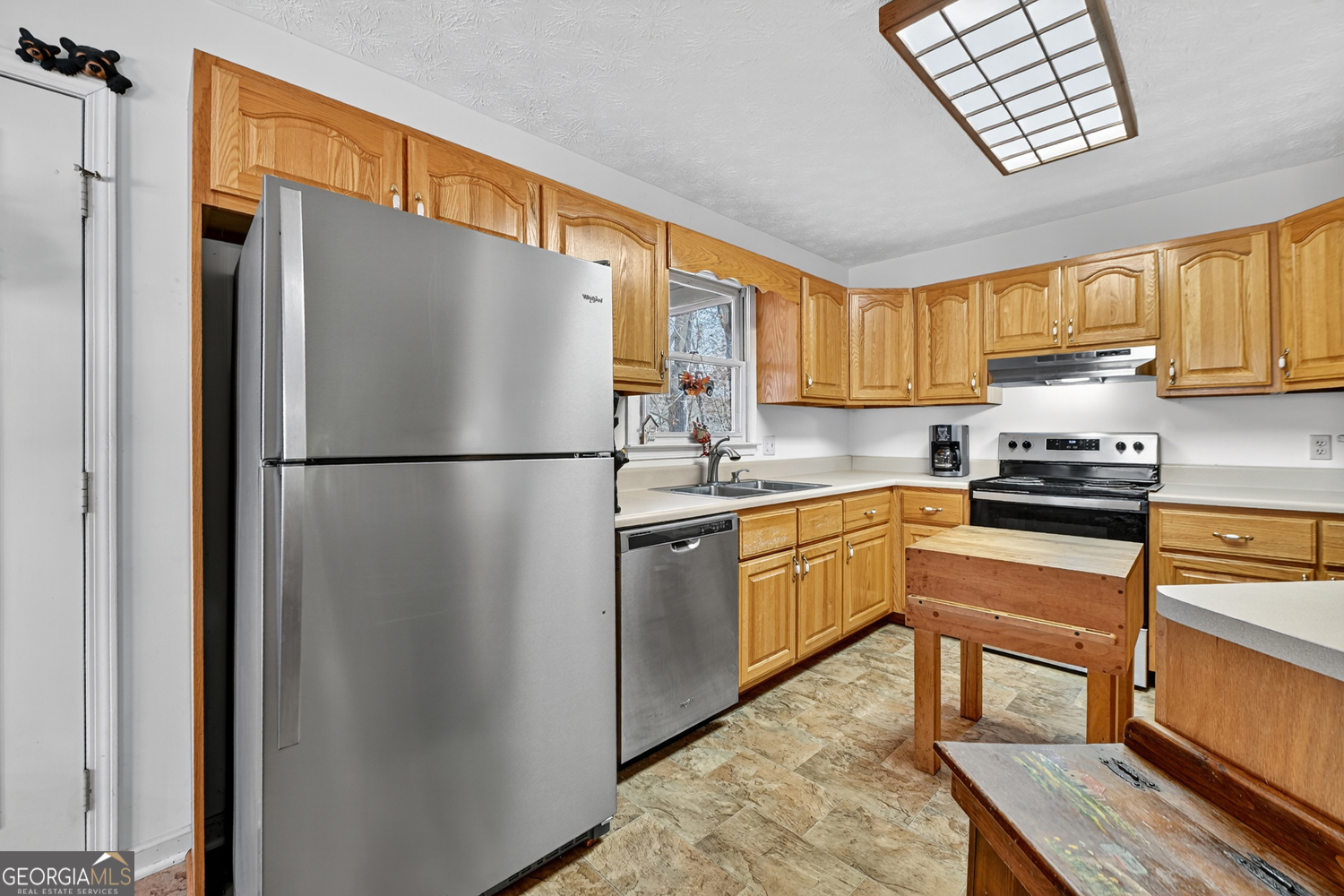 122 D D J Lane Ellijay, GA 30540 - Photo 24 of 51 a kitchen with a refrigerator a sink and cabinets