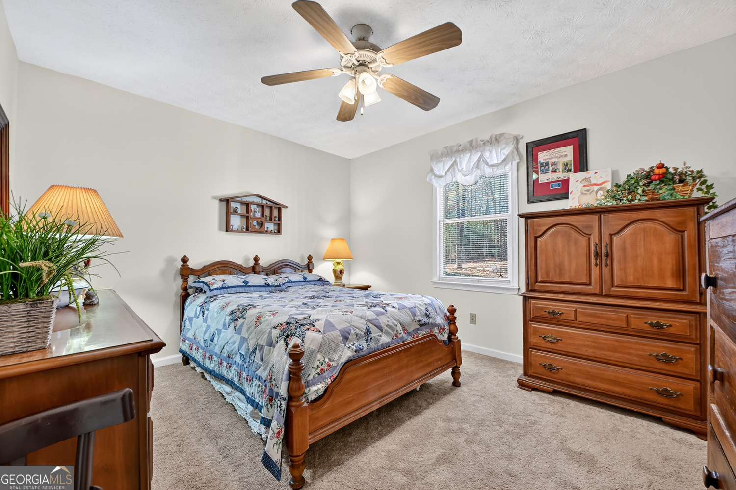 122 D D J Lane Ellijay, GA 30540 - Photo 29 of 51 a bedroom with a bed and a chandelier