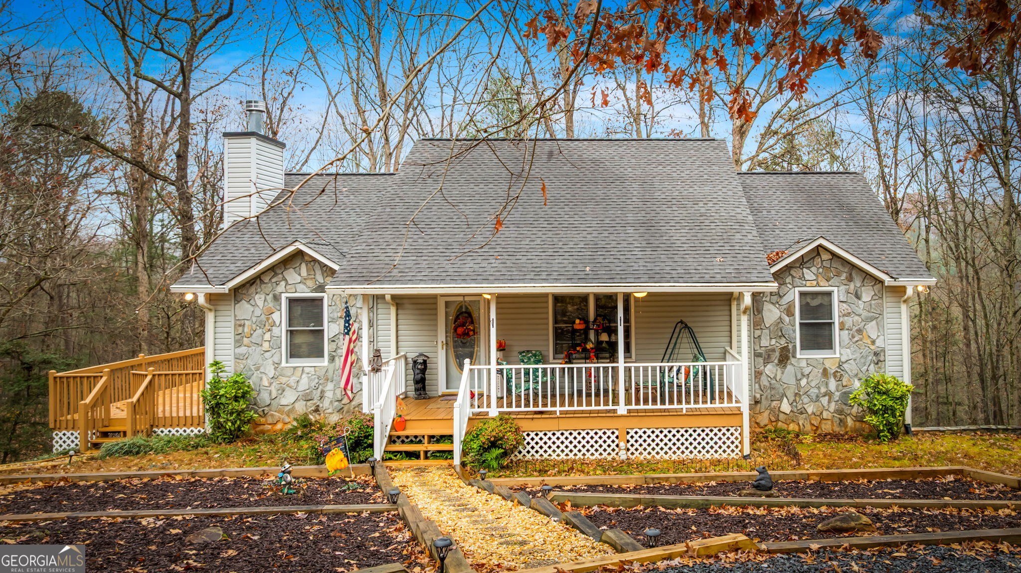 122 D D J Lane Ellijay, GA 30540 - Photo 3 of 51 a view of a brick house with a large trees and wooden fence