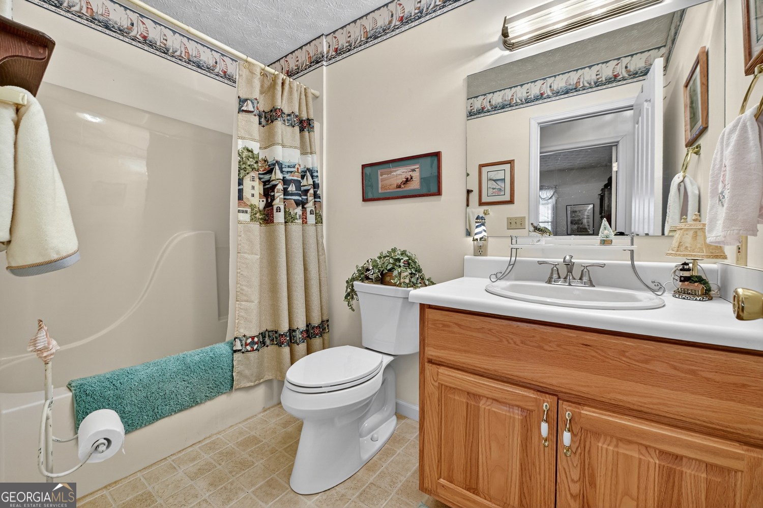 122 D D J Lane Ellijay, GA 30540 - Photo 31 of 51 a bathroom with a sink a toilet and shower